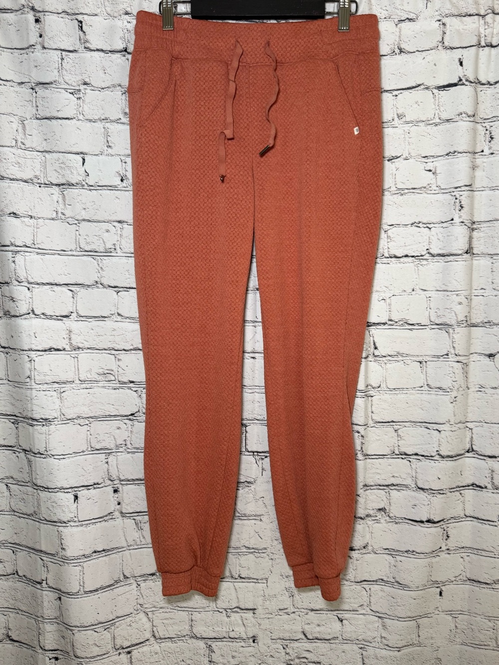 Marika. Orange joggers. Size S